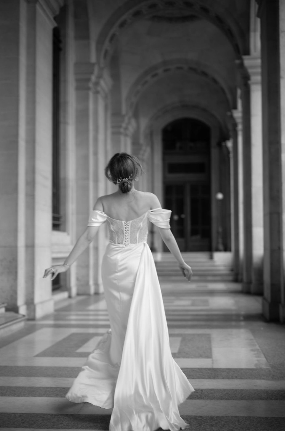 Bride in colonnade